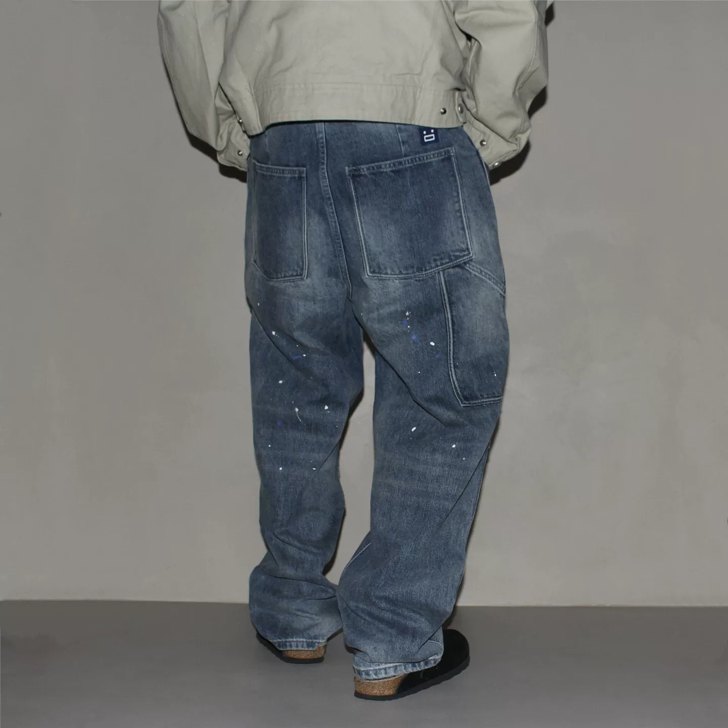 GcBrand Lab retro themed elements knee fold design Japanese washed distressed splashed ink jeans