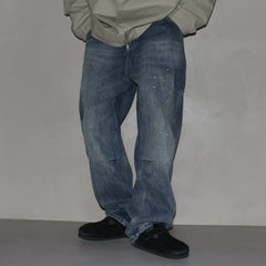 GcBrand Lab retro themed elements knee fold design Japanese washed distressed splashed ink jeans