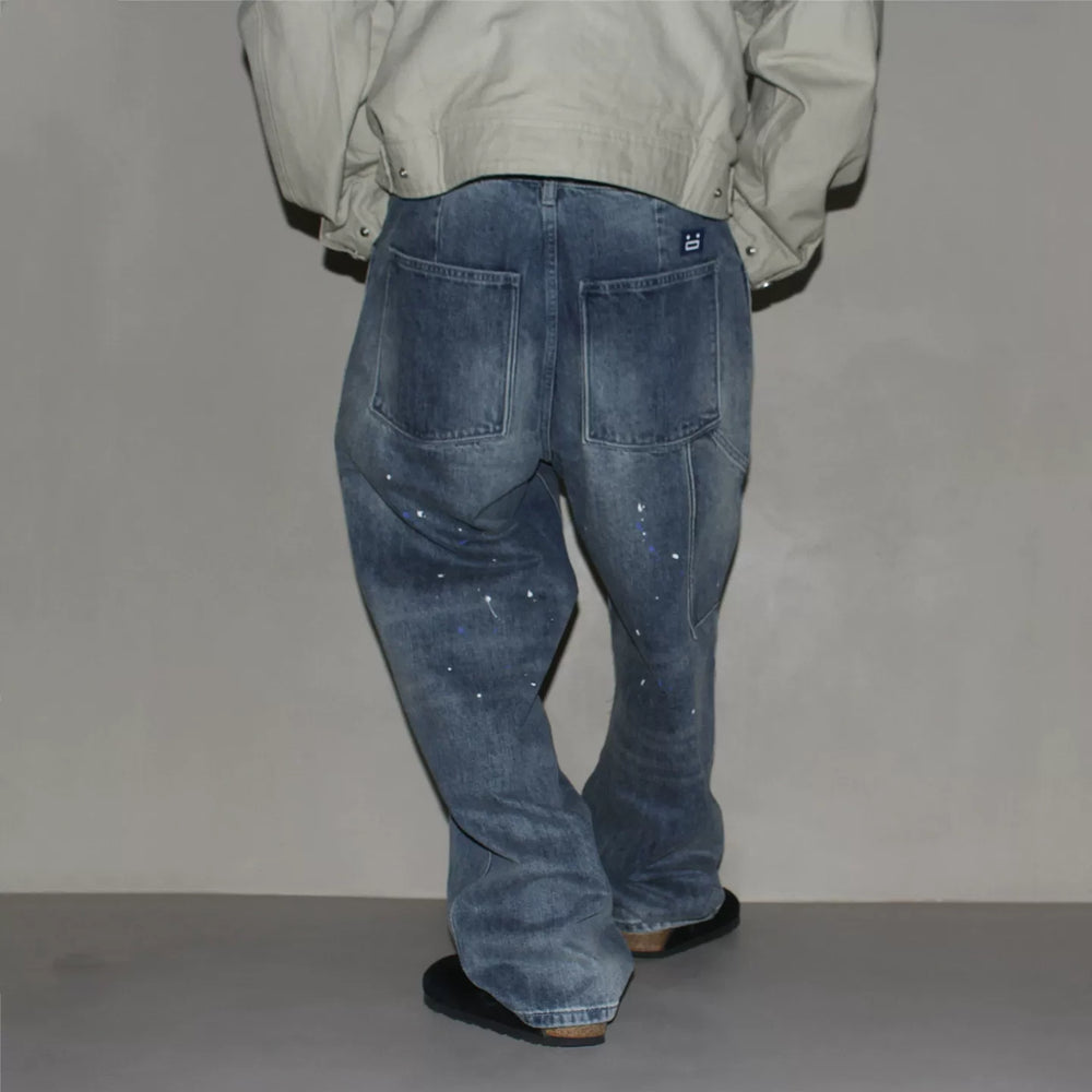 GcBrand Lab retro themed elements knee fold design Japanese washed distressed splashed ink jeans